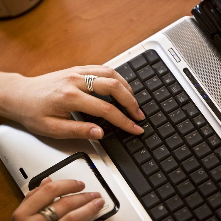 Image of Hands Working at Laptop