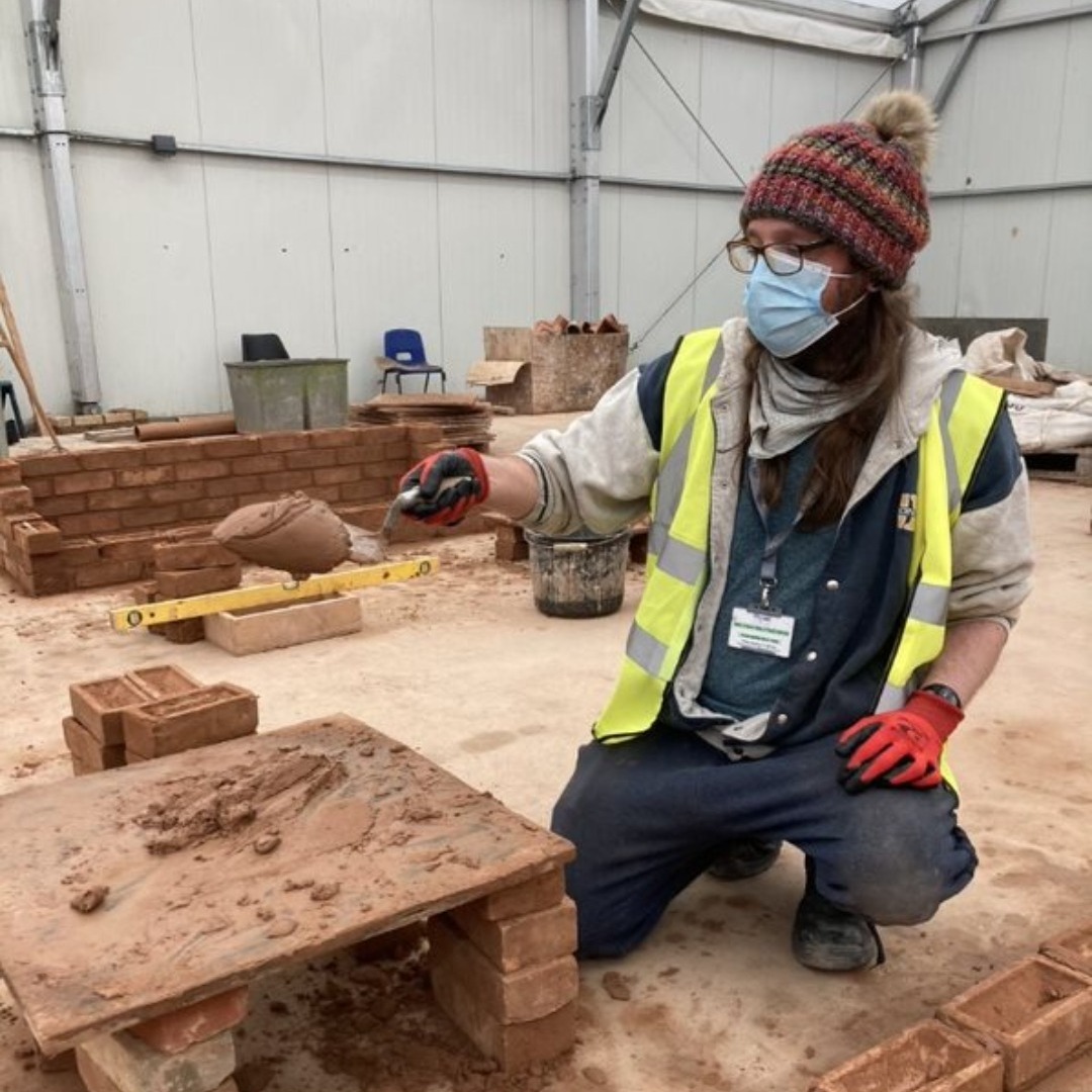 Luke Risbey - construction and plant operations student laying bricks