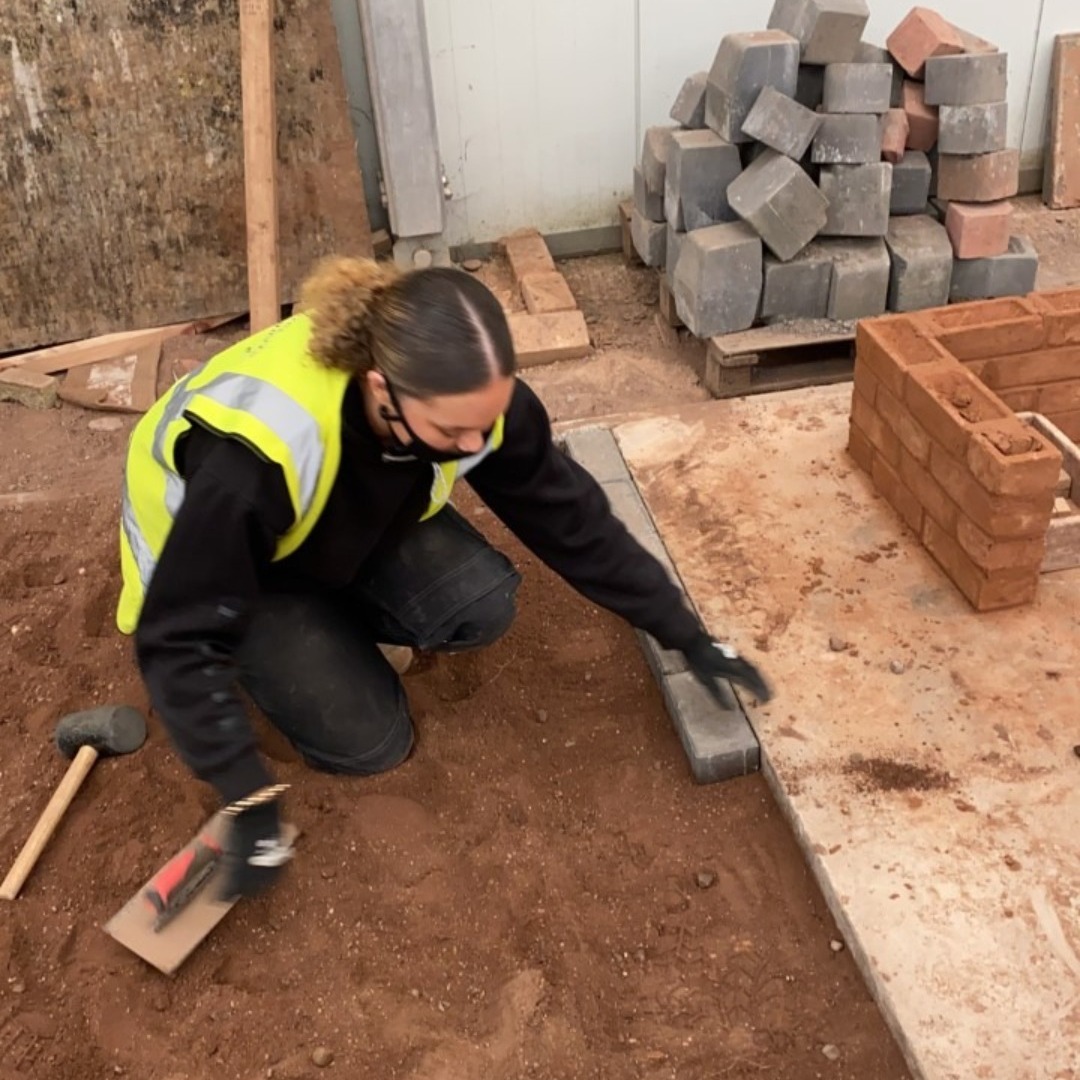 Sudent Lara Woods laying blockwork in the construction training centre
