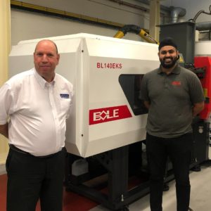 Left: Andrew Dermody member of staff from PTIC in a white shirt and Hardeep Khela, general manager from Bole Manufacturing in front of the new BL140EKS machine at the Polymer Training and Innovation Centre in Telford