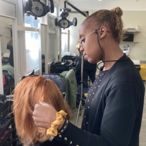 Hairdressing student Tara Stephens is pictured working on her model's hair