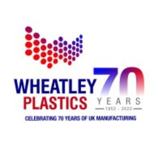 Wheatley Plastics company logo - Red and blue writing on a white background