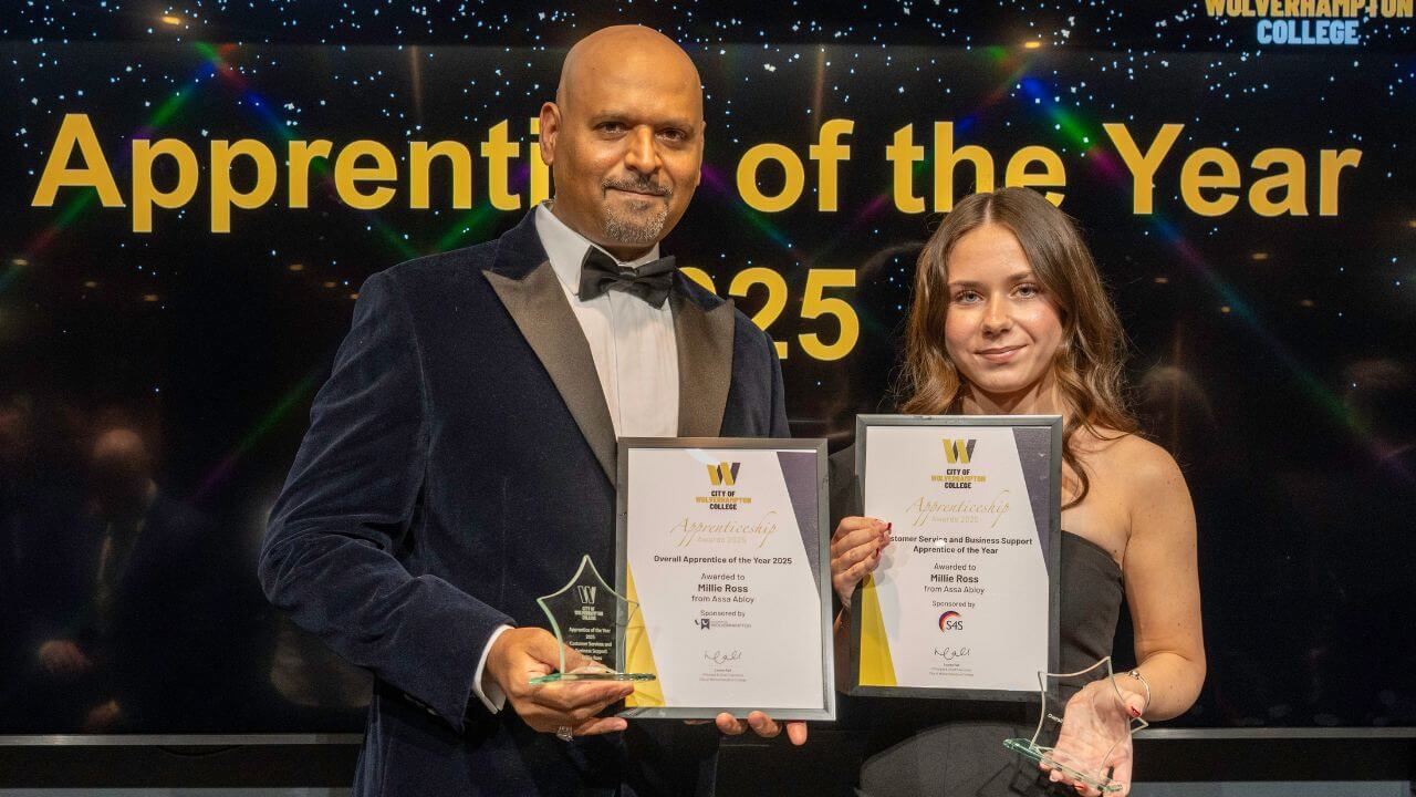 Millie |Ross, right, and Lloyd James, left holding the two certificates and two awards she won on the night