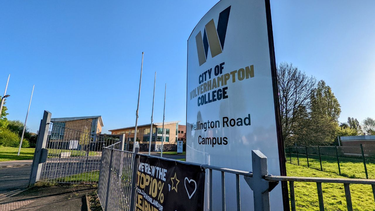 A shot of the outside of the Wellington Road campus, showing the main entrance sign with the college logo and the campus name on it