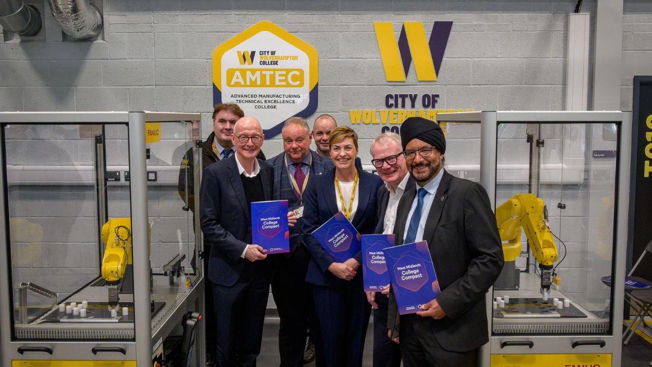 Louise Fall, principal and the college, centre, with Richard Parker, Mayor of the West Midlands, Pat McFadden MP for Wolverhampton SOuth East, Warinder Juss, MP for Wolverhampton West and other guers standing by manufacturing robots in the engineering workshop